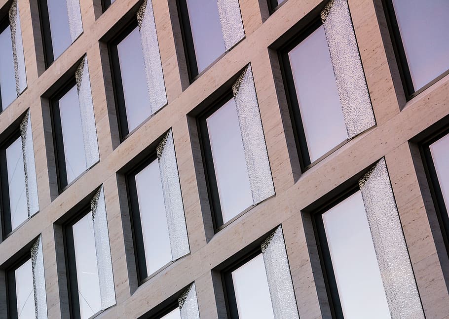 building with glass windows, low angle photo of gray framed glass-panel building HD wallpaper