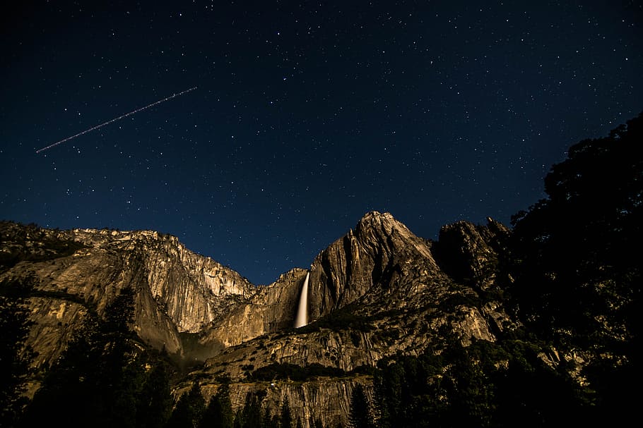 low angle photography of rock mountain under black sky at nighttime, Moon Kingdom HD wallpaper