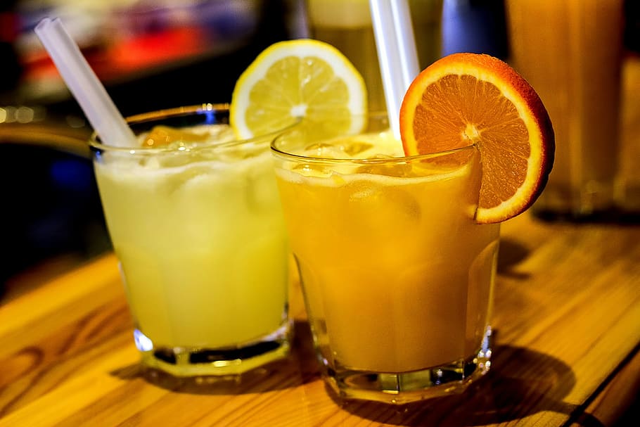 citrus and orange juice inside rock glasses, drink, cold, fruit