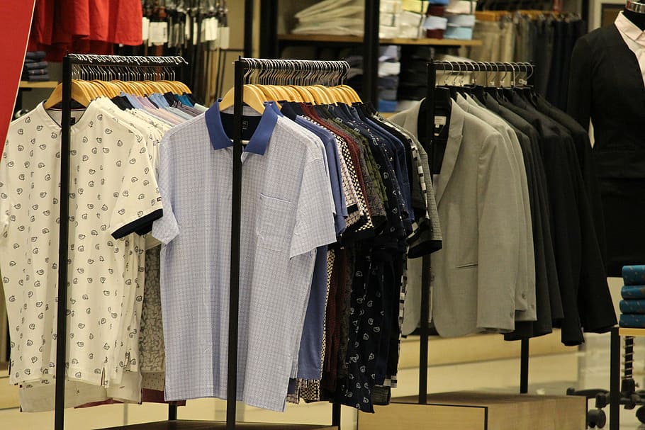shirt and suit jacket hanging on store racks, tshirt, shirts