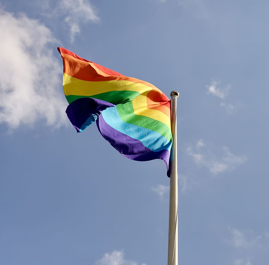 shallow focus photography of LGBT flag on white steel pole, Pride