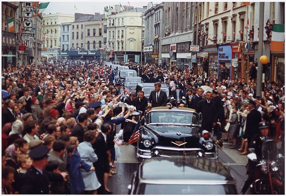 people watching John F Kennedy presidential parade during daytime