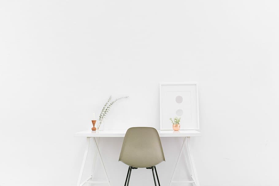 white wooden table near brown chair, photo of white table, desk