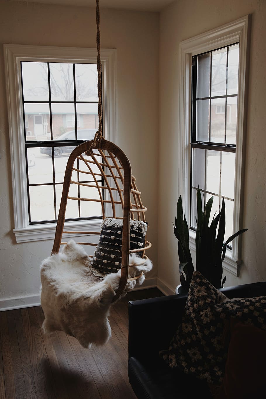brown wooden hanging chair with white fleece blanket and gray throw pillow beside window during daytime, brown hanging chair HD wallpaper
