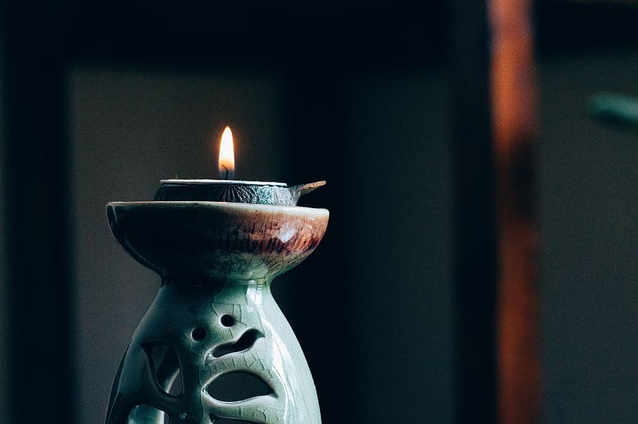 rule of thirds photography of lit candle, shallow focus photography of teal ceramic candle burner, HD wallpaper