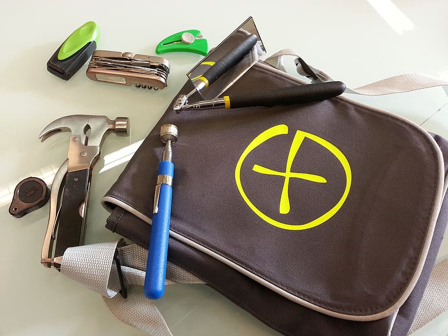 assorted miniature hammer, grinder, and Swiss knife with brown bag HD wallpaper