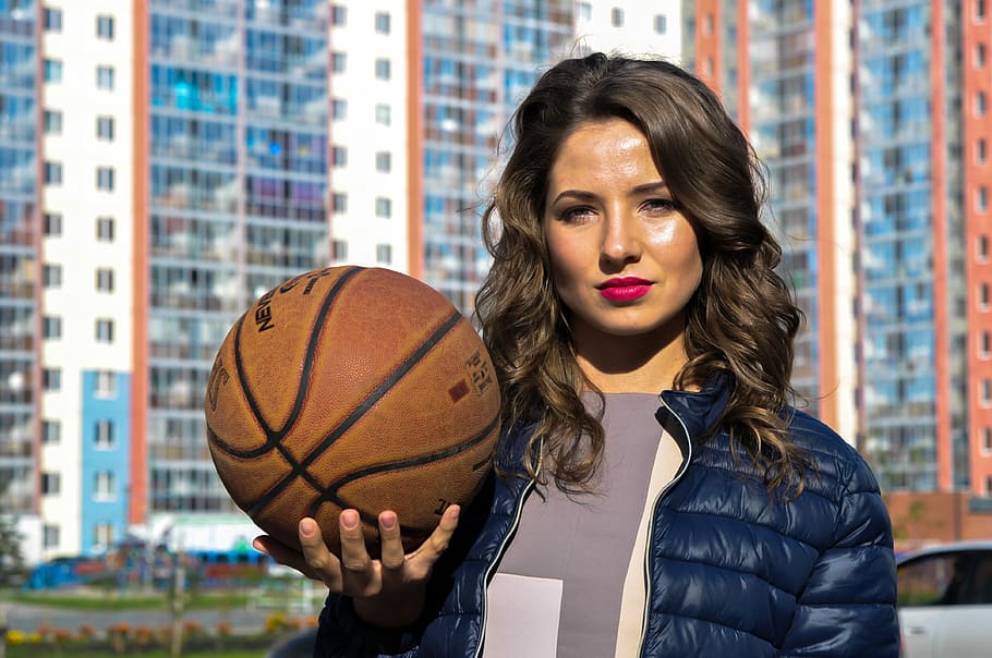 woman wearing dark-blue down jacket holding basketball, outdoors, HD wallpaper