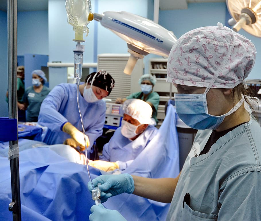 doctors performing operation, surgery, hospital, surgical team