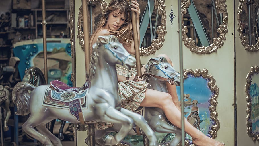 woman riding horse carousel, woman riding on a carousel, amusement park HD wallpaper