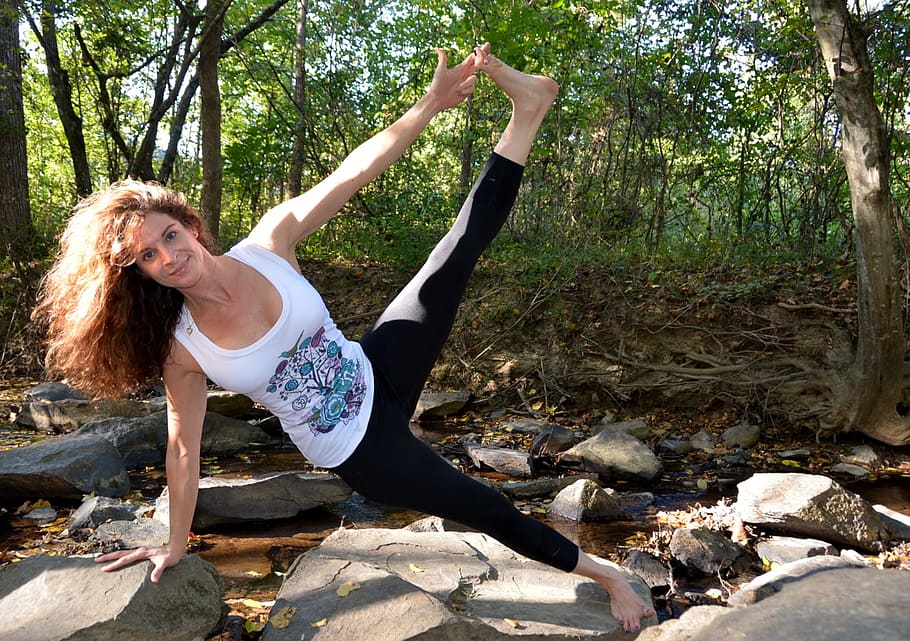 woman wearing white tank top Stretching legs  on top of gray rock HD wallpaper