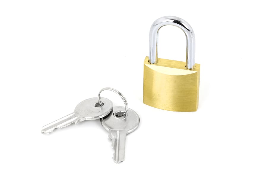 photo of gold and silver colored pad lock and two keys, close