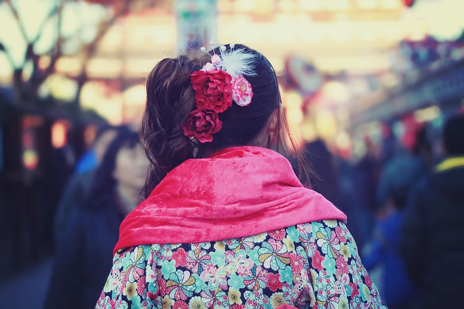 selective focus photography of woman with pink satin scarf in crowd HD wallpaper