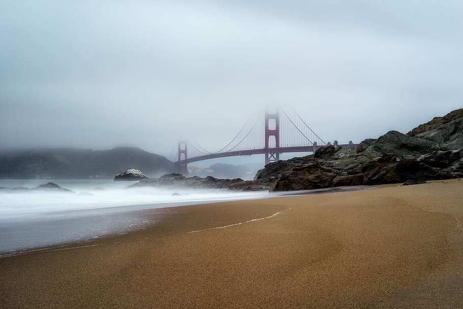 Golden Gate Bridge covered by fogs, Golden Gate Bridge, beach HD wallpaper