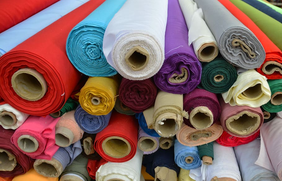 assorted color rolled textiles, cloth, fabric, silk, cotton, design