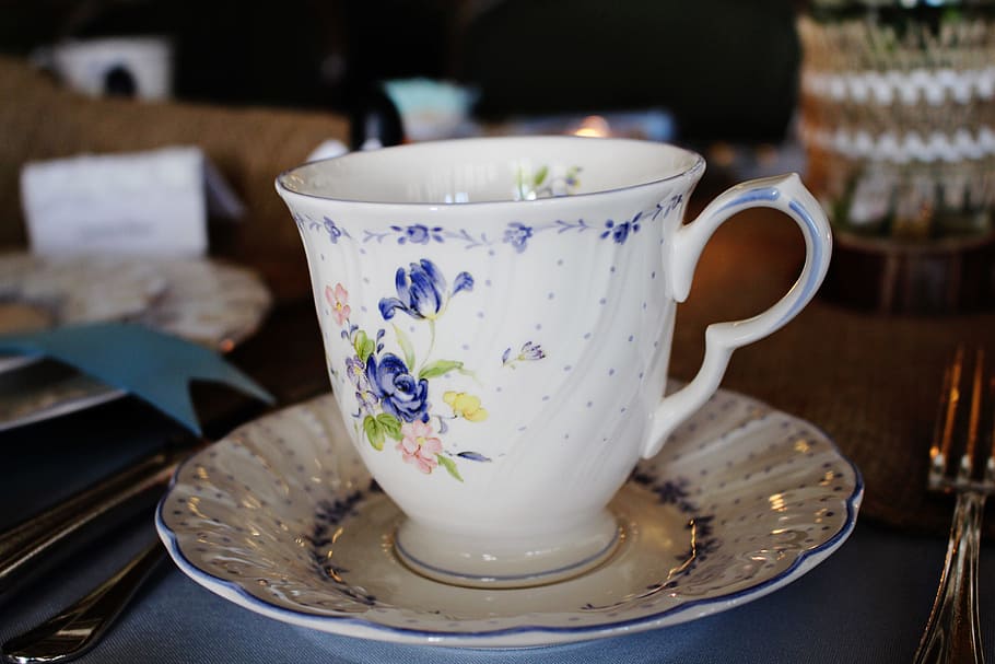 white and blue floral ceramic up on saucer, tea cup, traditional HD wallpaper