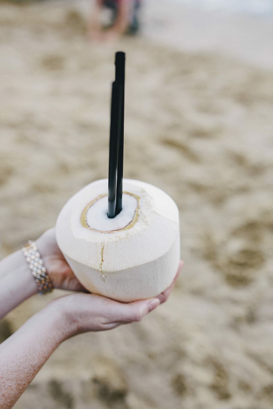 Female holding a fresh coconut, summer, fruit, holidays, vacations, HD wallpaper