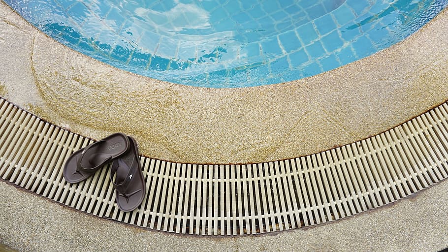 pair of black flip-flops on brown surface, pool, shoes, water HD wallpaper