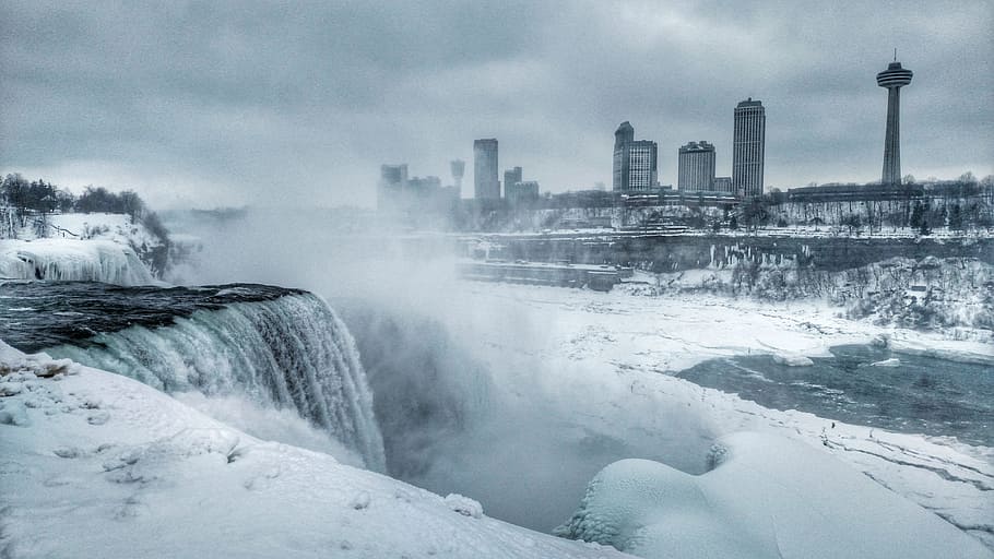 time-lapse photography of waterfalls and city, niagra falls, skylon tower