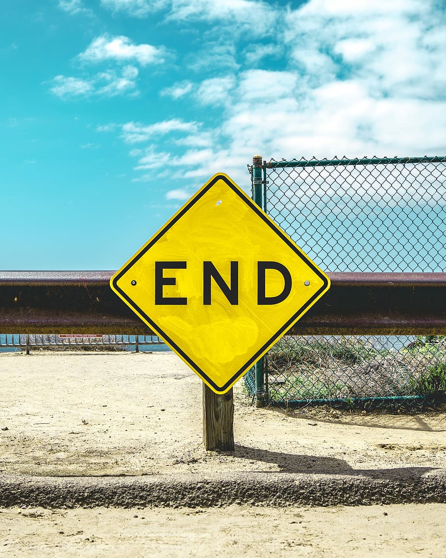 End sign on beige sand, End signage on side of road, post, railing HD wallpaper