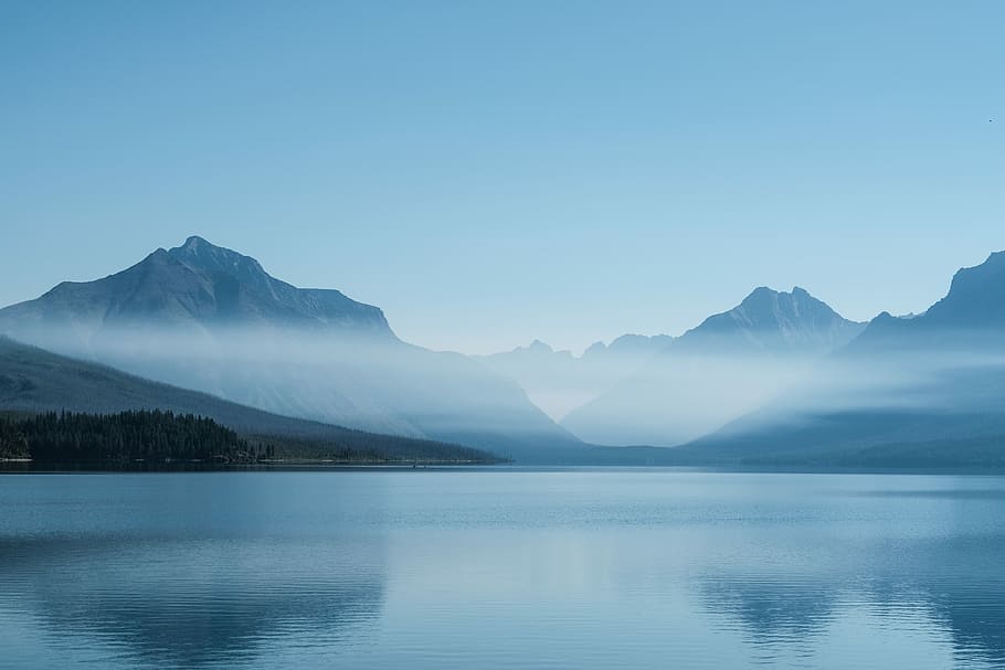 The Misty Mountains of Glacier National Park, mountain near body of water HD wallpaper