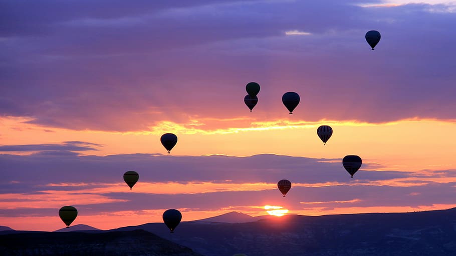 silhouette photo of air balloons during golden hour, outdoor HD wallpaper
