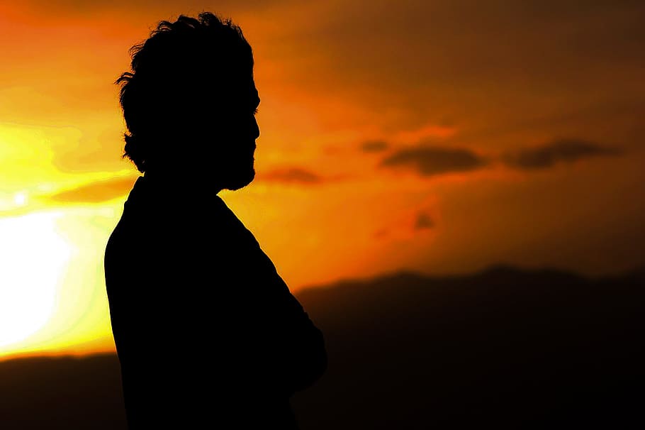 Silhouette Photo of a Man, backlit, blurred background, clouds HD wallpaper