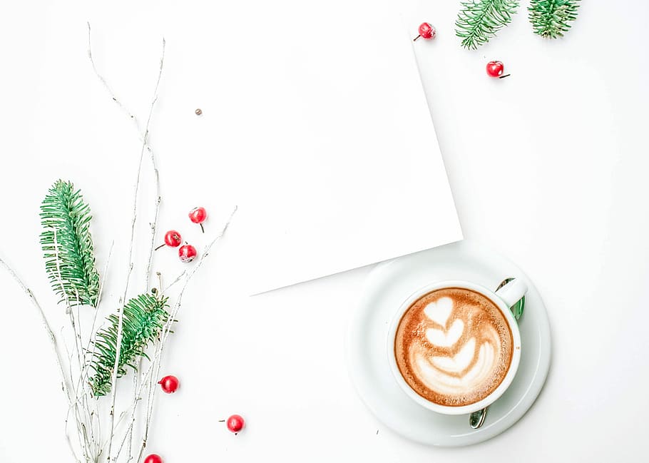 coffee latte art on table, photo of white coffee cup and green leaf HD wallpaper