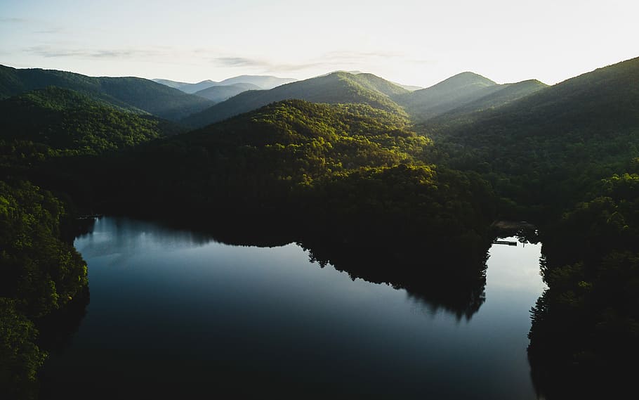 mountains surrounded by body of water during daytime, calm body of water near green mountain at daytime HD wallpaper