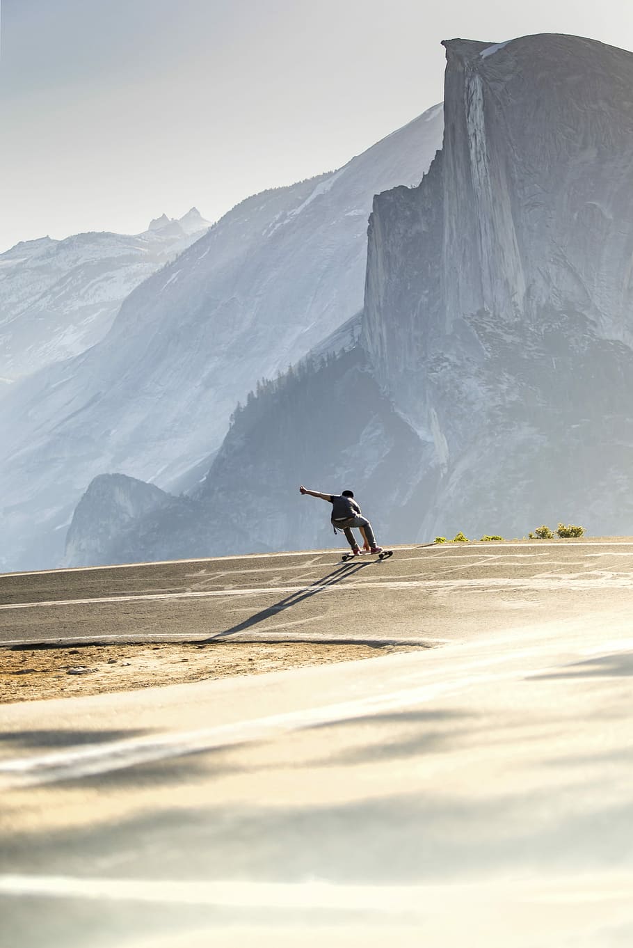man riding longboard, man on a skateboard, mountain, cliff, rock HD wallpaper