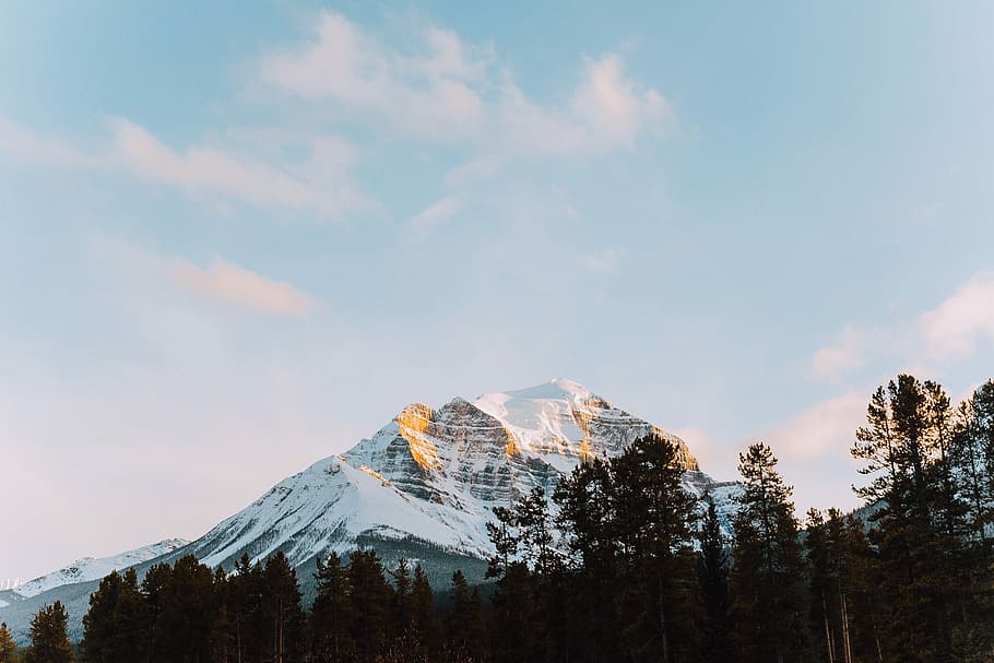 bottom view of white and black mountain, icy mountain under blue sky HD wallpaper