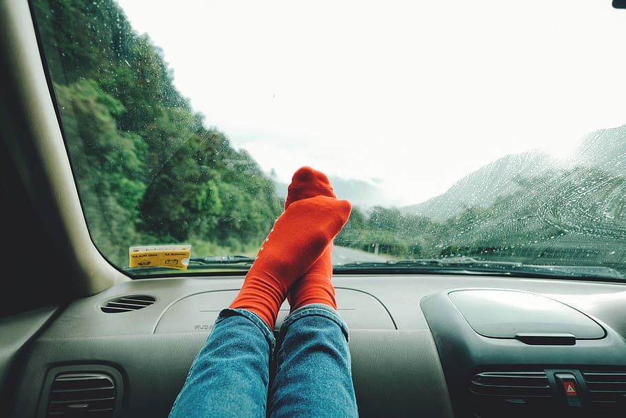 person wearing red socks near mountain, person stepping on black car interior HD wallpaper