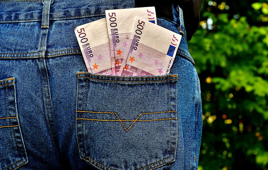 three 500 Euro banknotes on person's pants pouch, Money, Jeans