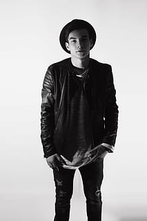 grayscale photo of man oin leather jacket and hood, guy, in hat HD wallpaper