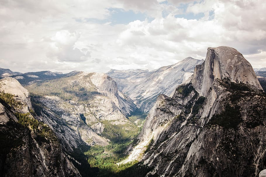 gray rocky mountain, mountains taken under white clouds during daytime HD wallpaper