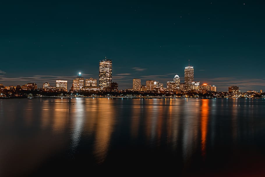 city buildings next to body of water during nighttime, city with lights skyline photo HD wallpaper