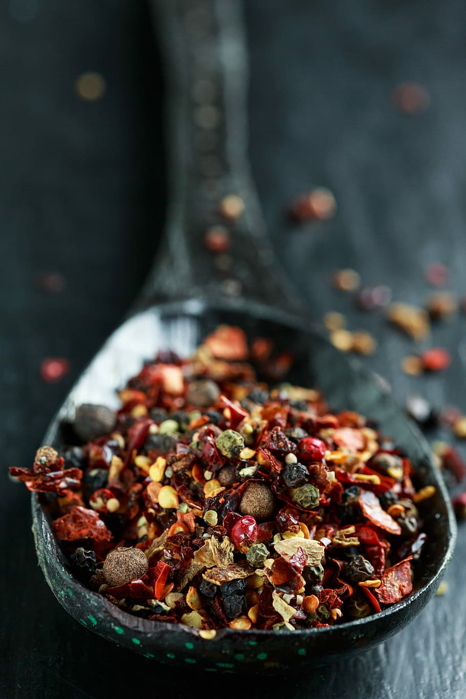 selective focus photography of fruit shells in spoon, Spices