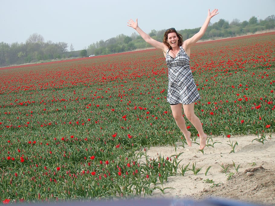 tulip, flowers, spring, red, colorful, jump, human arm, limb HD wallpaper