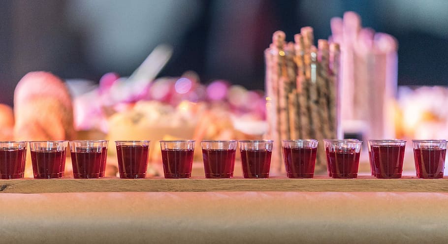 shot glasses filled with red liquid, selective focus photography of shot glasses HD wallpaper