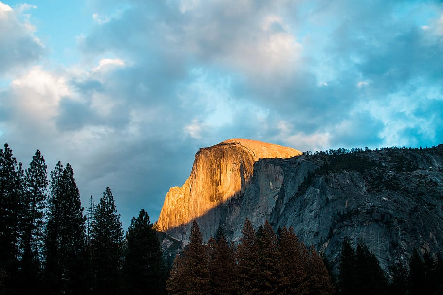 Breathe - Orange & Blue, sunlight over rocky mountain during daytime HD wallpaper
