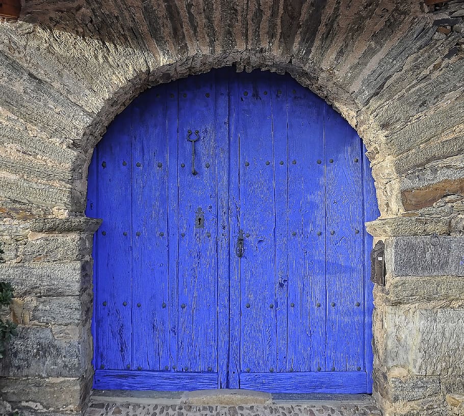 photography of royal-blue wooden window, double doors, entrance