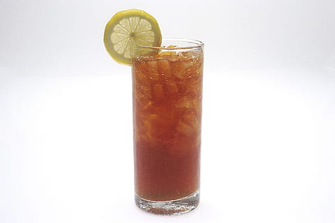 tea in a glass with ice and lemon against white background HD wallpaper