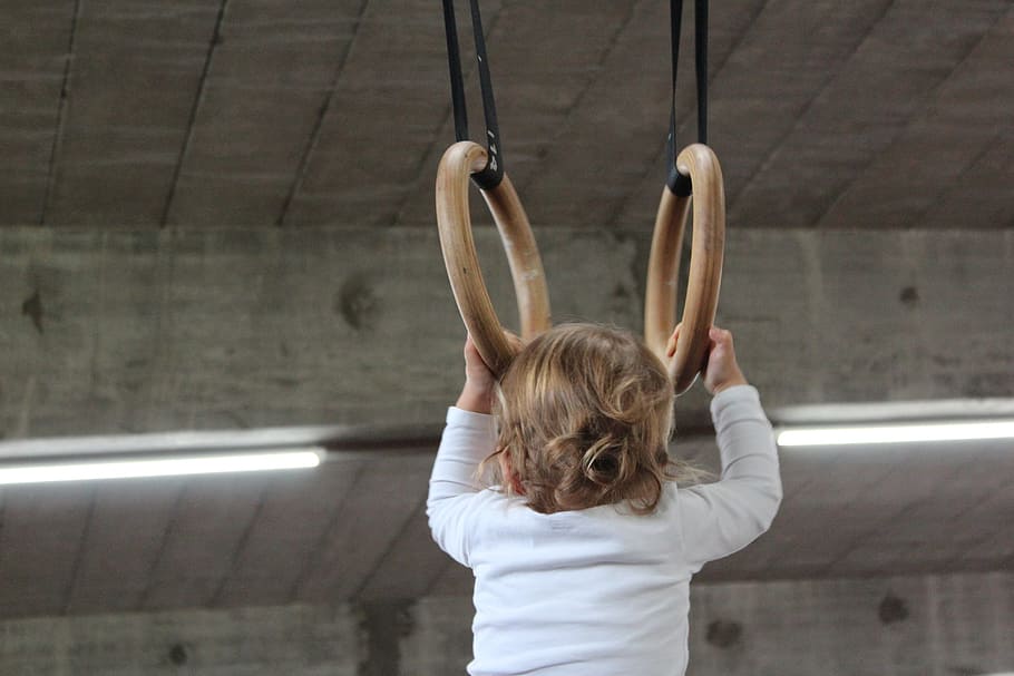 baby holding on two brown rings, Small, Child, Gymnastics, Depend HD wallpaper