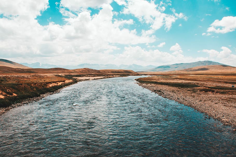 clear sky over river, river running through mountains and hills HD wallpaper