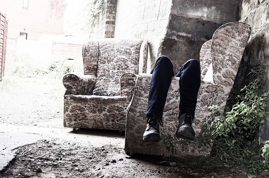 person lying on a wing chair, depression, sadness, murder, thinking HD wallpaper