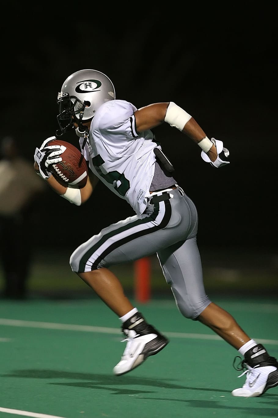 Football Player Holding Football, action, American football, athlete