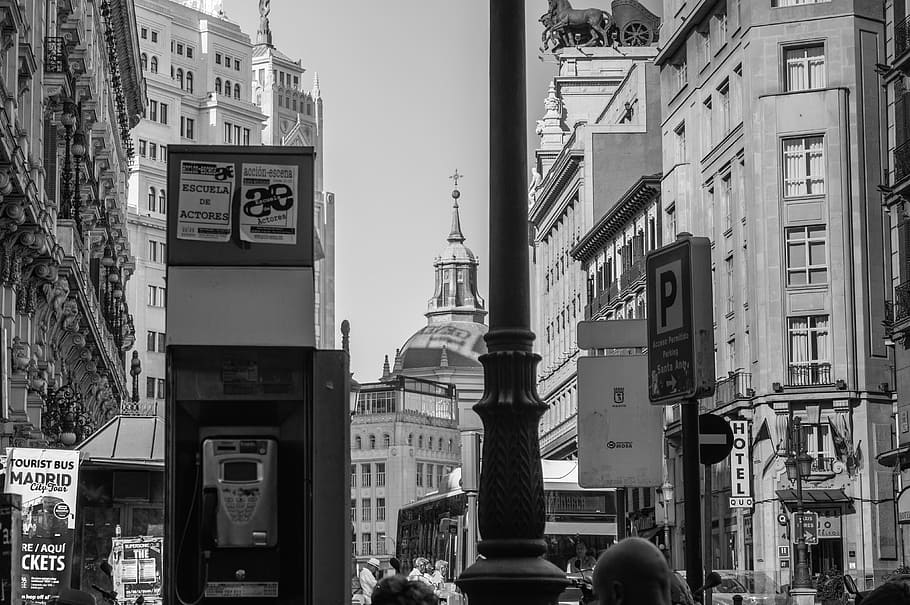 gray scale photo of telephone booth and high rise buildings, blackandwhite