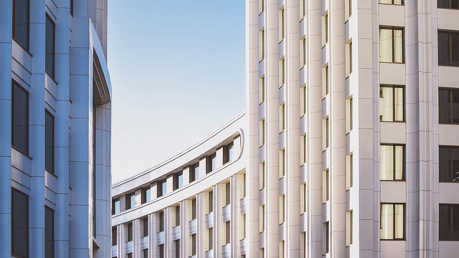 curved white concrete building, photography of white high-rise building HD wallpaper