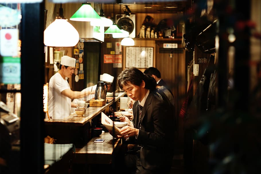 man reading book, people, men, restaurant, adult, cafe, women HD wallpaper