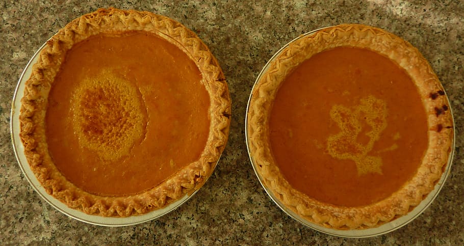 close-up photo of two baked pie on white ceramic plates, pumpkin pie HD wallpaper