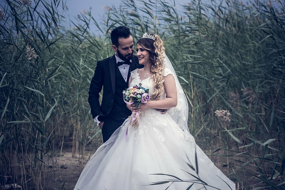couple surrounded with green leaf plants at daytime, adult, bridal